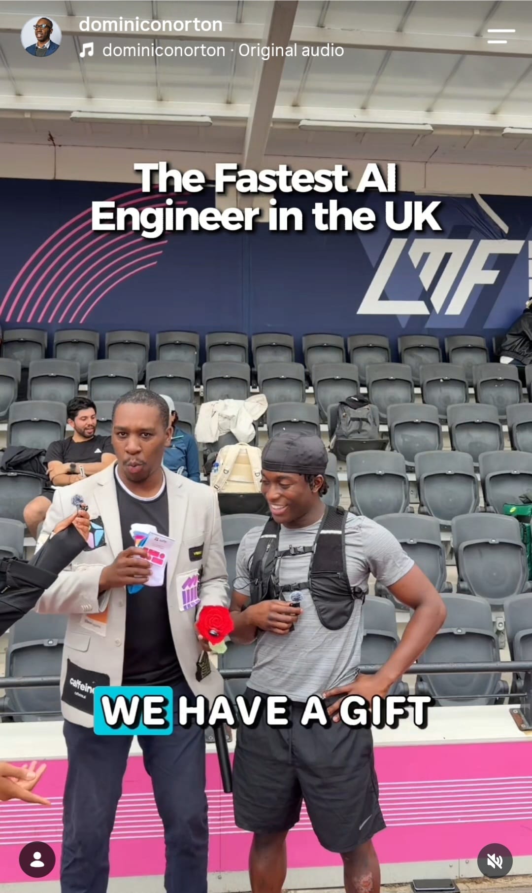 Social media interview at a stadium with advertiser brand patches visible on the interviewer's blazer